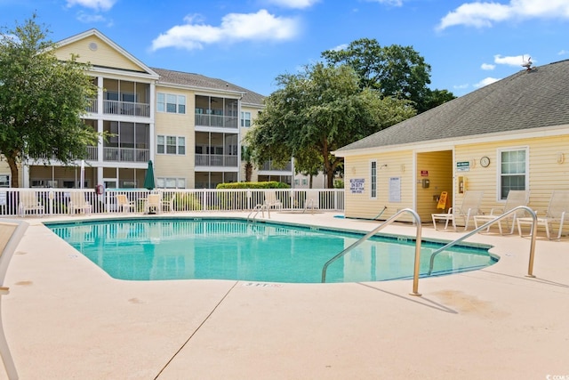 view of swimming pool featuring a patio area