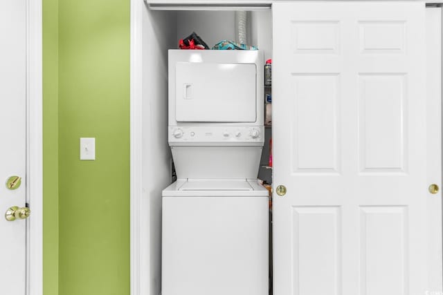 washroom with stacked washer / dryer