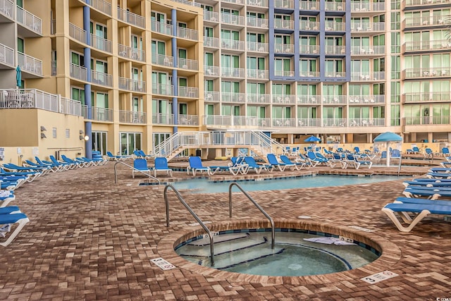 view of pool featuring a community hot tub