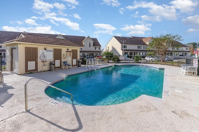 view of swimming pool with a patio