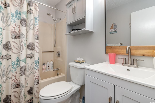 full bathroom featuring shower / bath combo, toilet, a textured ceiling, and vanity