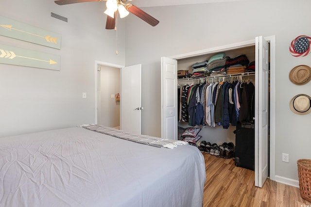 bedroom featuring ceiling fan, a closet, and light hardwood / wood-style floors