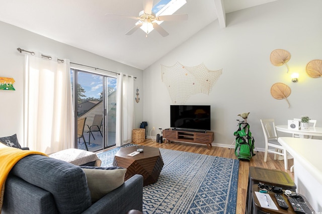 living room featuring lofted ceiling with beams, ceiling fan, and wood-type flooring