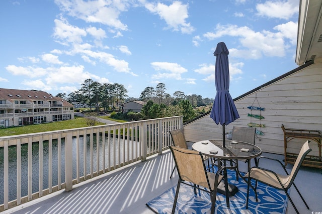 wooden terrace with a water view