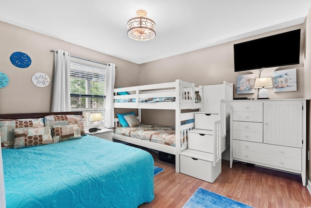 bedroom with hardwood / wood-style floors