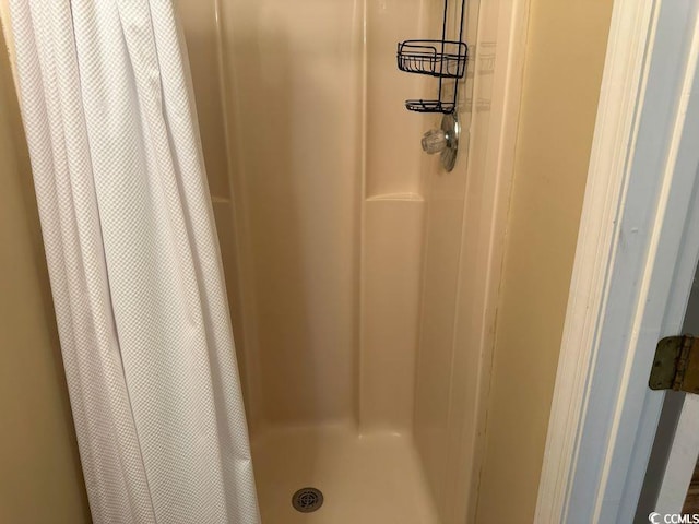 1095 W Plantation Dr Unit 28-I, Little River, SC 29566 - bathroom view of a shower with shower curtain