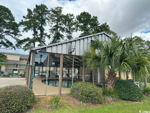 1095 W Plantation Dr Unit 28-I, Little River, SC 29566 - back of house with a patio