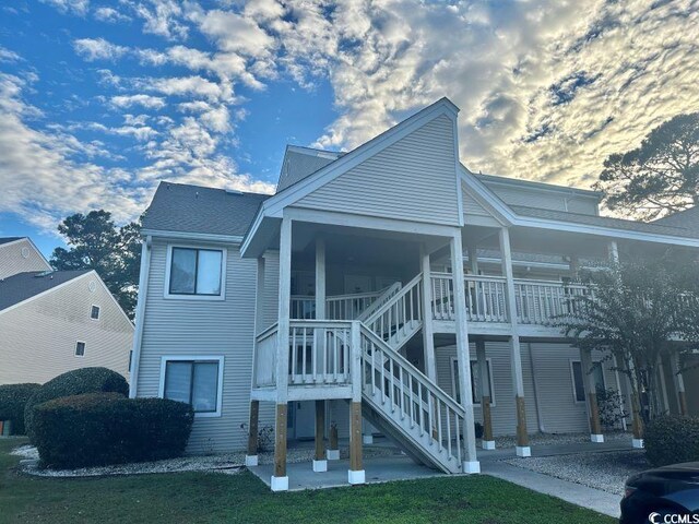 1095 W Plantation Dr Unit 28-I, Little River, SC 29566 - back of property with a patio area and stairs