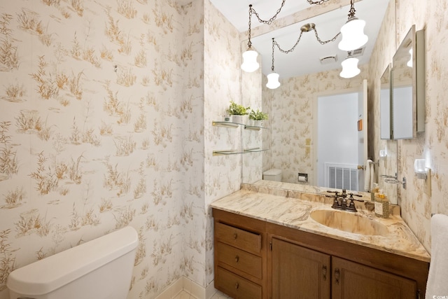 bathroom with vanity and toilet