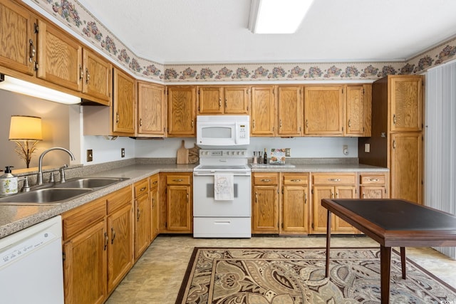 kitchen with sink and white appliances