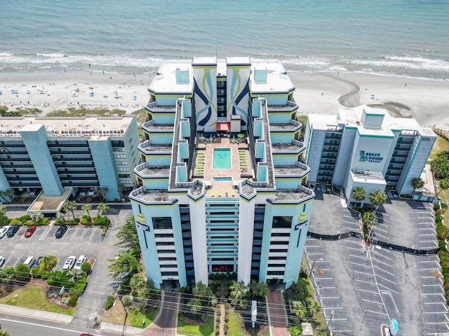 aerial view with a view of the beach and a water view