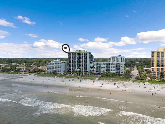 bird's eye view featuring a beach view and a water view