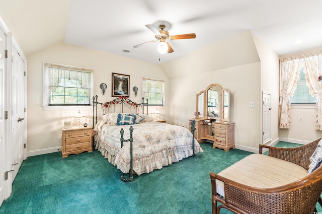 bedroom featuring ceiling fan, dark carpet, and multiple windows