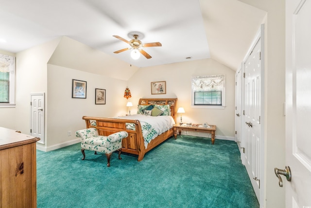 carpeted bedroom with vaulted ceiling and ceiling fan