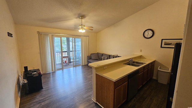 kitchen with kitchen peninsula, ceiling fan, sink, black dishwasher, and dark hardwood / wood-style floors