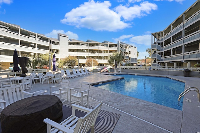 view of pool featuring a patio