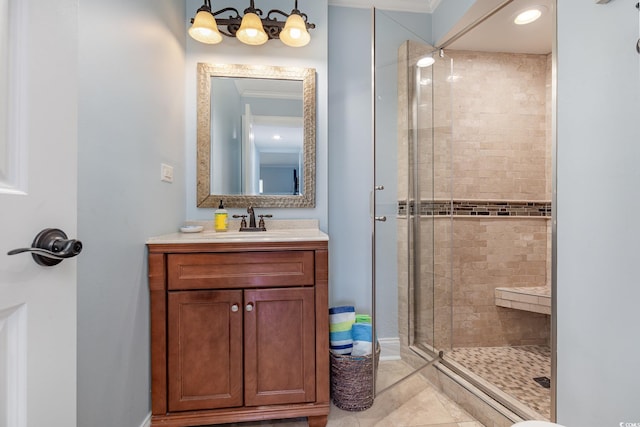 bathroom featuring tile patterned floors, vanity, ornamental molding, and walk in shower