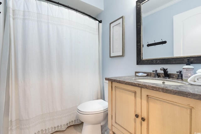 bathroom featuring tile patterned flooring, vanity, toilet, and ornamental molding