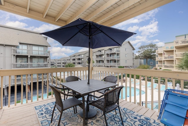 deck featuring a community pool