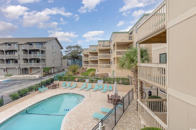 view of swimming pool with a patio area