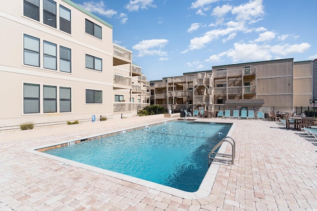 view of swimming pool with a patio