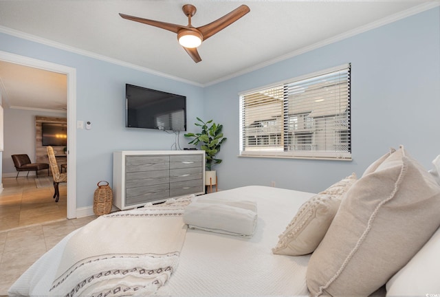 bedroom with light tile patterned floors, ceiling fan, and ornamental molding