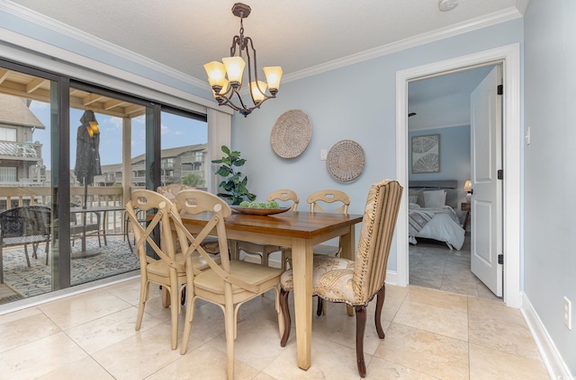 dining area with crown molding and a chandelier