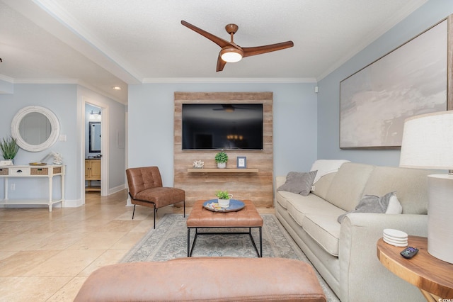 living room with ceiling fan, light tile patterned floors, a textured ceiling, and ornamental molding