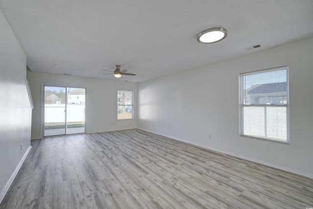 spare room featuring ceiling fan and light hardwood / wood-style flooring