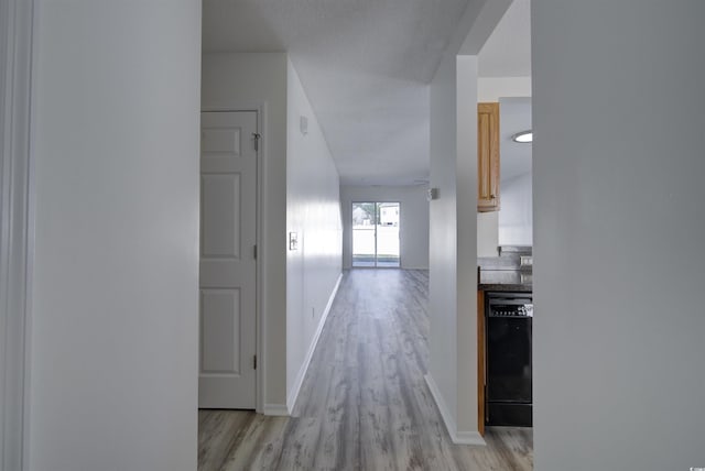 hallway with light wood-type flooring