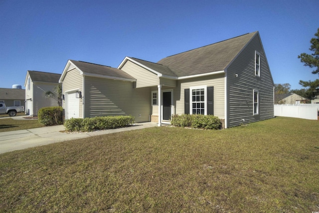 view of front of home with a garage and a front yard