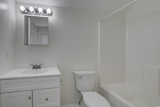 full bathroom featuring vanity, a textured ceiling, toilet, and shower / bathtub combination