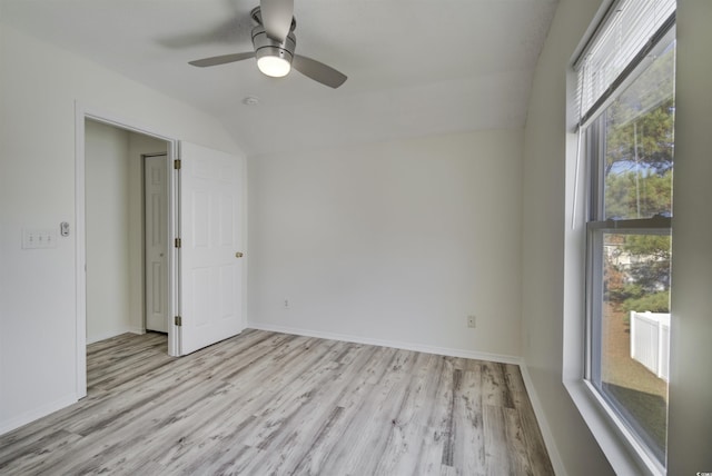 unfurnished room with light wood-type flooring, ceiling fan, and lofted ceiling