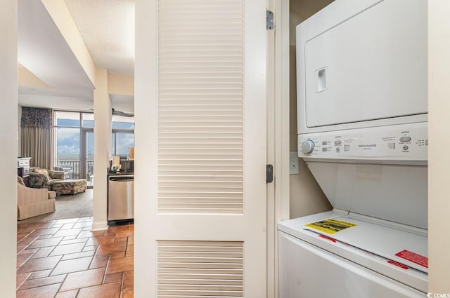 laundry area featuring stacked washer and clothes dryer