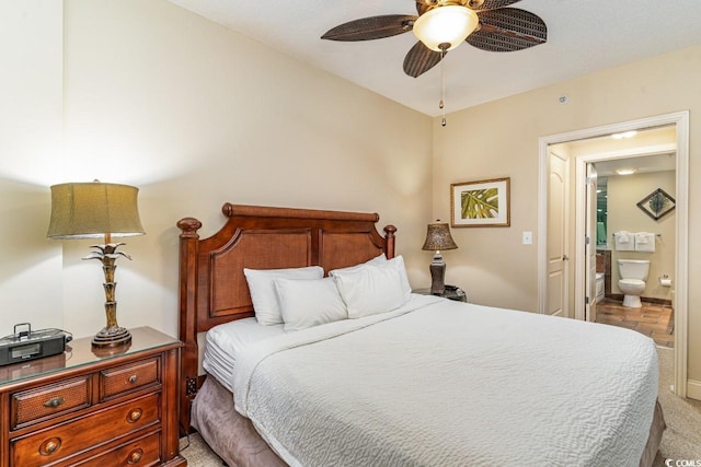 carpeted bedroom featuring connected bathroom and ceiling fan