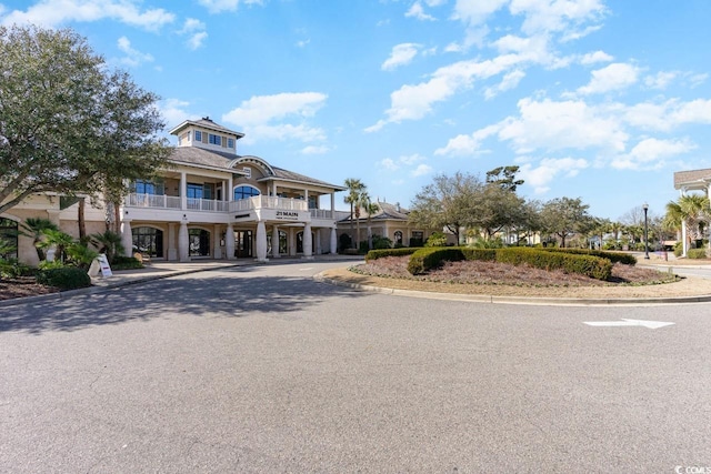 view of front of property with a balcony