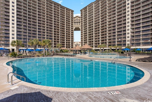 view of swimming pool featuring a patio