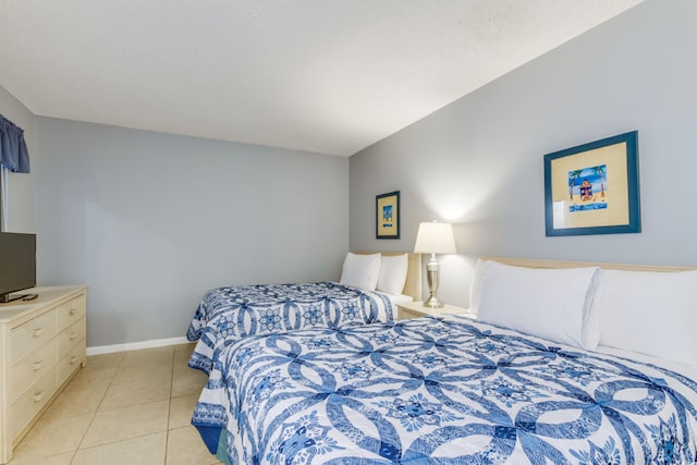 bedroom with light tile patterned floors