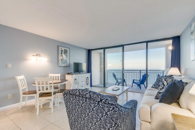 tiled living room with floor to ceiling windows