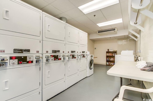 laundry room with stacked washer and dryer and washer and dryer