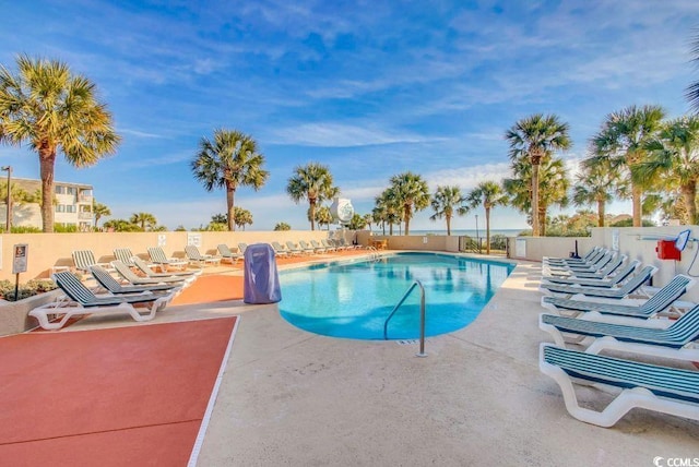 view of swimming pool with a patio