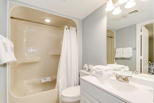 full bathroom featuring shower / bathtub combination with curtain, vanity, and toilet