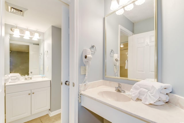 bathroom with vanity and tile patterned floors