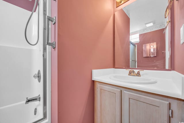 bathroom featuring bathing tub / shower combination and vanity