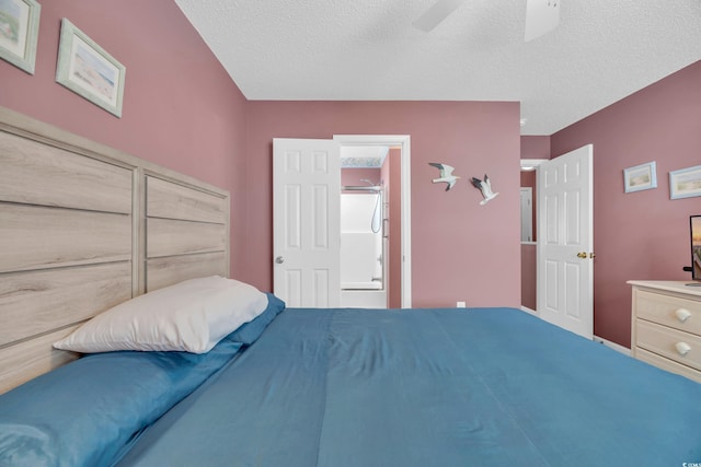 bedroom with ceiling fan, ensuite bathroom, and a textured ceiling