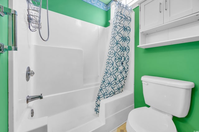 bathroom featuring shower / bath combo and toilet