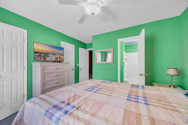 bedroom with ceiling fan and a textured ceiling