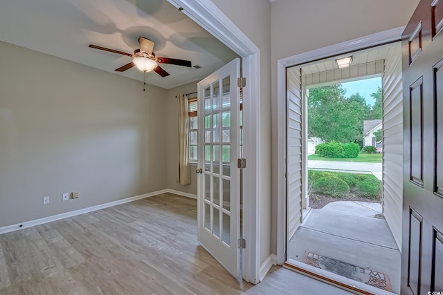 entryway featuring ceiling fan and light hardwood / wood-style flooring