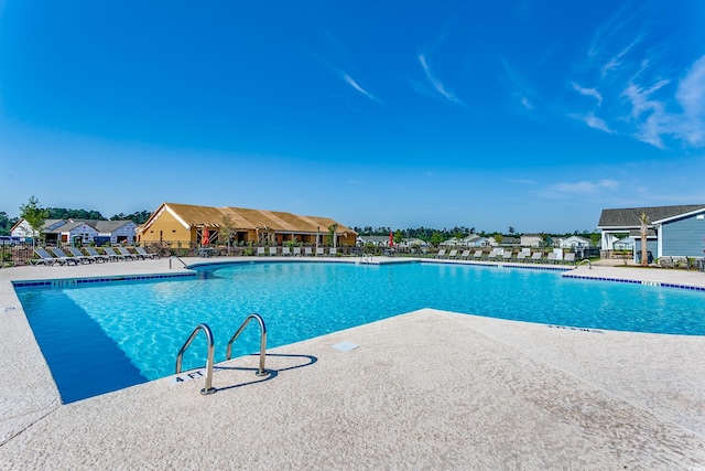 view of pool featuring a patio