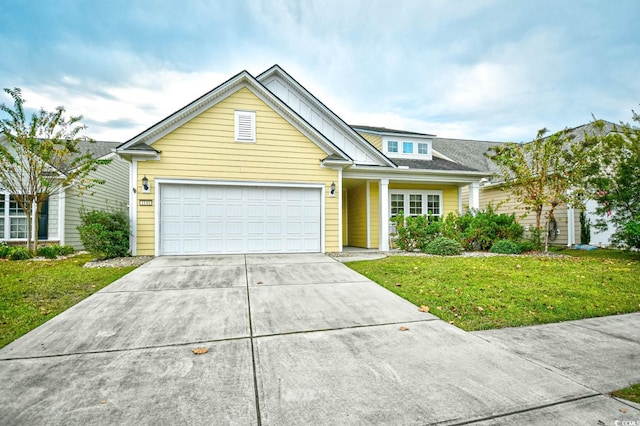 view of front facade with a garage and a front yard